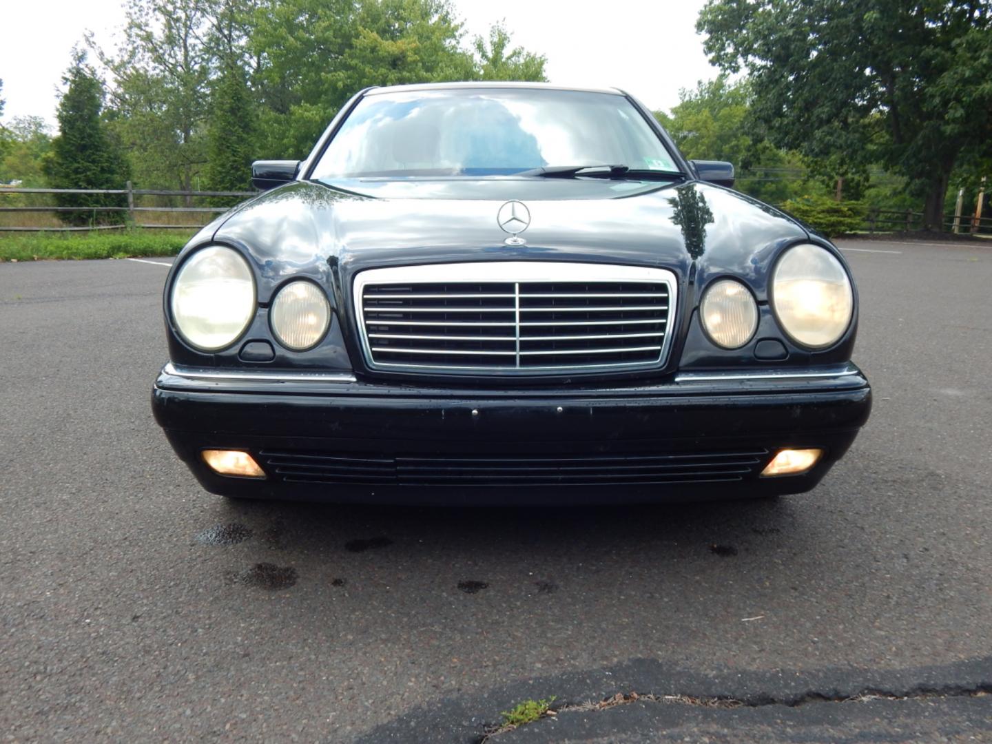 1999 Black /Tan Leather Mercedes-Benz E-Class E320 4-Matic (WDBJF82H2XX) with an 3.2L V6 SOHC 18V engine, 5-Speed Automatic Overdrive transmission, located at 6528 Lower York Road, New Hope, PA, 18938, (215) 862-9555, 40.358707, -74.977882 - Here we have a Mercedes E320 with a 3.2L V6 putting power to all four wheels via an automatic transmission. Options include: tan leather, wood trim, keyless entry, cruise control, tilt steering wheel, A/C, power windows/locks/mirrors, power moonroof, power and heated front seats, AM/FM/CD radio, dua - Photo#6