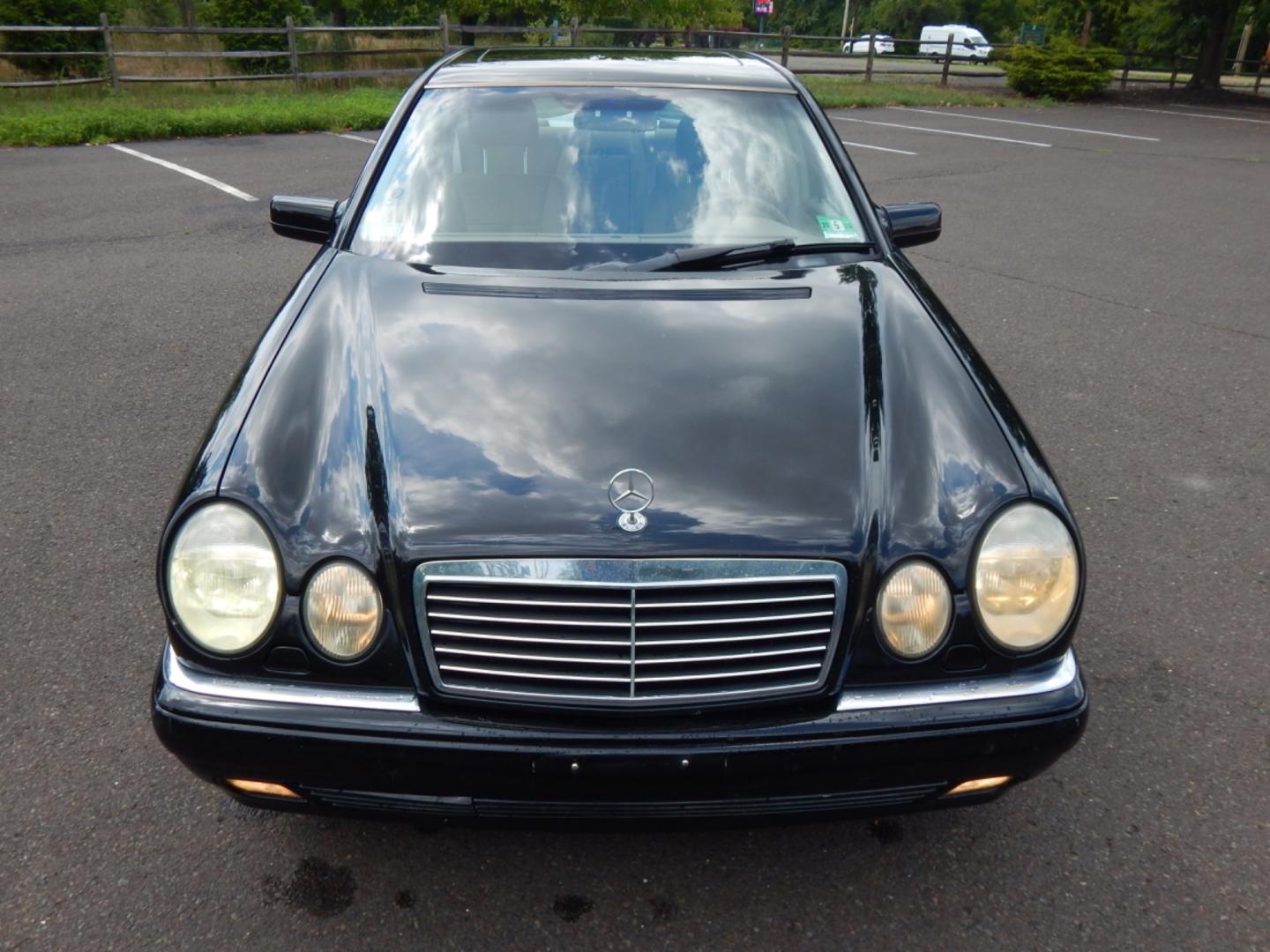 1999 Black /Tan Leather Mercedes-Benz E-Class E320 4-Matic (WDBJF82H2XX) with an 3.2L V6 SOHC 18V engine, 5-Speed Automatic Overdrive transmission, located at 6528 Lower York Road, New Hope, PA, 18938, (215) 862-9555, 40.358707, -74.977882 - Here we have a Mercedes E320 with a 3.2L V6 putting power to all four wheels via an automatic transmission. Options include: tan leather, wood trim, keyless entry, cruise control, tilt steering wheel, A/C, power windows/locks/mirrors, power moonroof, power and heated front seats, AM/FM/CD radio, dua - Photo#8