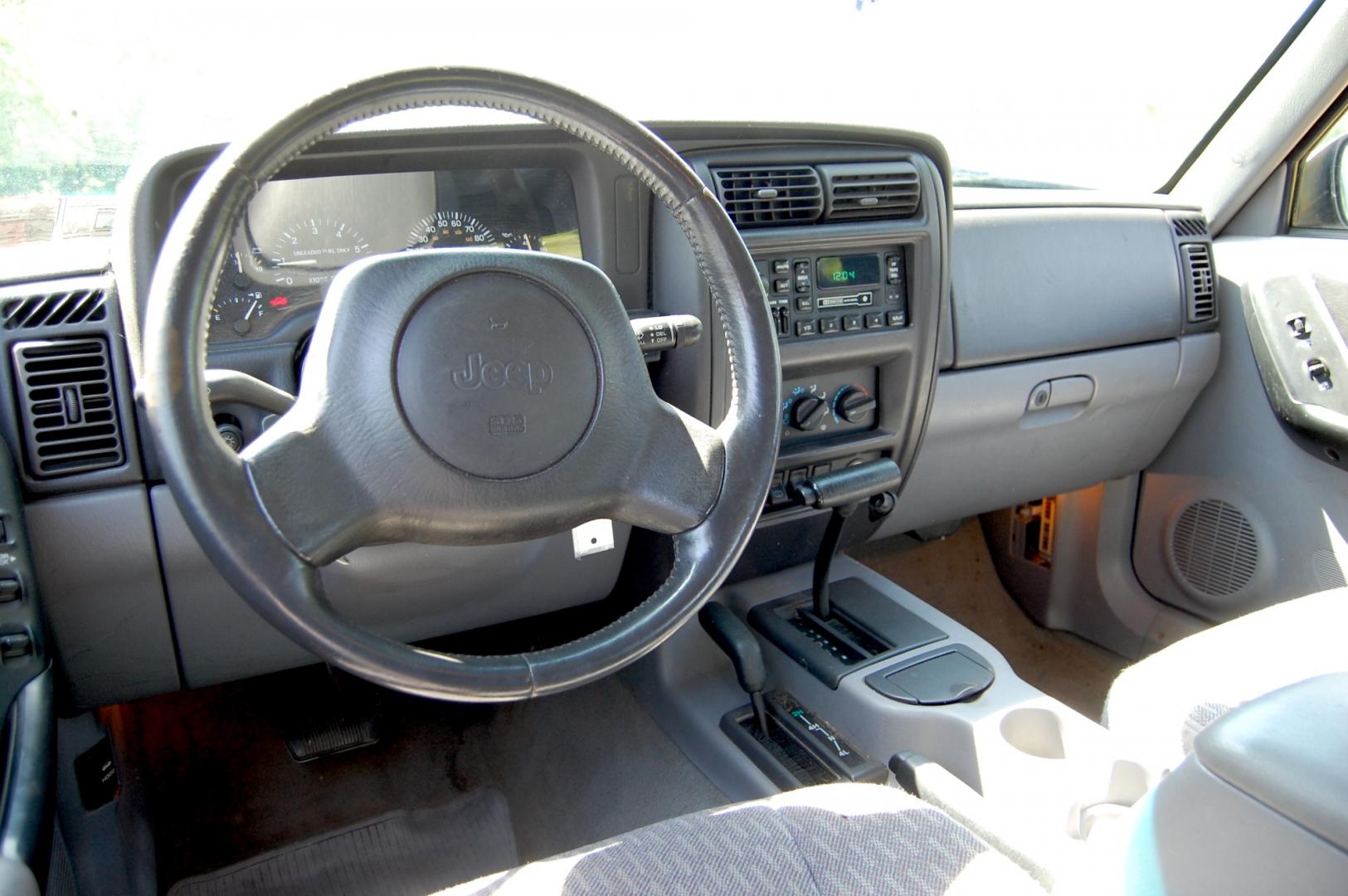 1998 Blue /Grey Jeep Cherokee Sport 4-Door 4WD (1J4FJ68S2WL) with an 4.0L L6 OHV 12V engine, Automatic transmission, located at 6528 Lower York Road, New Hope, PA, 18938, (215) 862-9555, 40.358707, -74.977882 - Here for sale is a 1998 Jeep Cherokee, has a 4.0 Liter straight six cylinder engine putting power to all 4 wheels via automatic transmission. The interior offers gray cloth, heat/AC, rear defrost, AM/FM/tape/CD sound system. Tilt wheel, power windows, locks and mirrors. Dual front air bags. Exteri - Photo#9