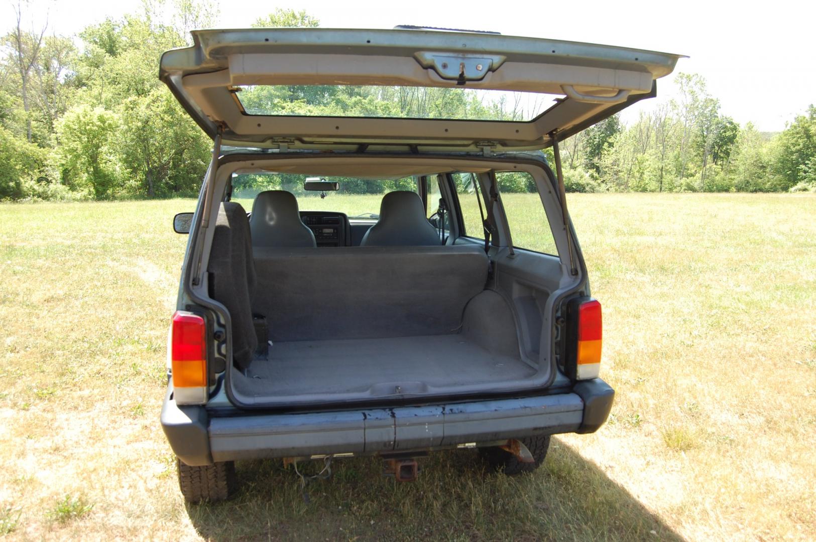 1998 Blue /Grey Jeep Cherokee Sport 4-Door 4WD (1J4FJ68S2WL) with an 4.0L L6 OHV 12V engine, Automatic transmission, located at 6528 Lower York Road, New Hope, PA, 18938, (215) 862-9555, 40.358707, -74.977882 - Here for sale is a 1998 Jeep Cherokee, has a 4.0 Liter straight six cylinder engine putting power to all 4 wheels via automatic transmission. The interior offers gray cloth, heat/AC, rear defrost, AM/FM/tape/CD sound system. Tilt wheel, power windows, locks and mirrors. Dual front air bags. Exteri - Photo#15