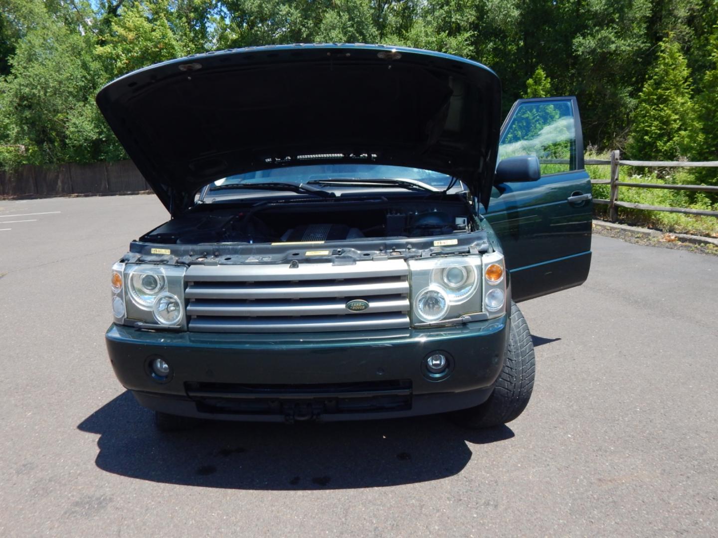 2003 Green /Tan Leather Land Rover Range Rover HSE (SALME11433A) with an 4.4L V8 DOHC 32V engine, 5-Speed Automatic Overdrive transmission, located at 6528 Lower York Road, New Hope, PA, 18938, (215) 862-9555, 40.358707, -74.977882 - Here we have a Range Rover HSE with a 4.4L V8 putting power to all four wheels via a smooth shifting automatic transmission. Options include: tan leather, dual climate controls, heated seats all around, moonroof, power front seats, AM/FM/DISC/TAPE radio, Harman/Kardon speakers, heated steering wheel - Photo#23