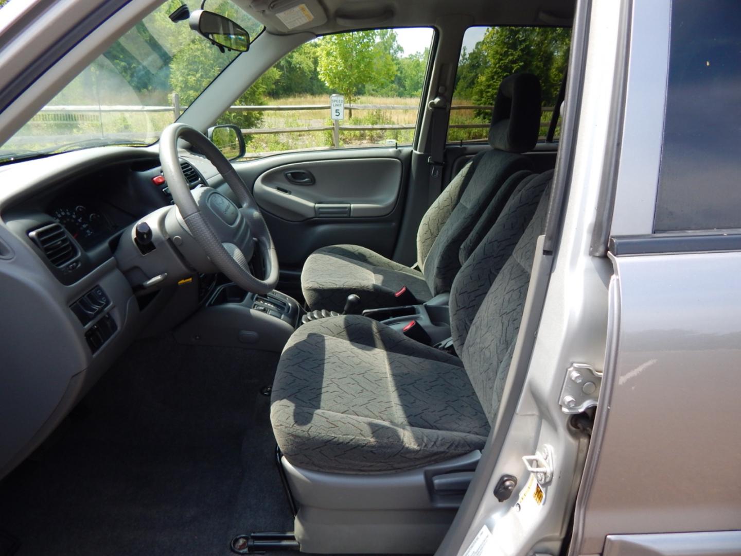 2004 Silver /Gray Cloth Chevrolet Tracker ZR2 4WD (2CNBJ734946) with an 2.5L V6 DOHC 24V engine, 4-Speed Automatic Overdrive transmission, located at 6528 Lower York Road, New Hope, PA, 18938, (215) 862-9555, 40.358707, -74.977882 - Here we have a Chevrolet Tracker with a 2.5L V6 putting power to a 4x4 automatic transmission. Options include: gray cloth, keyless entry, 1 remote and 1 key, cruise control, tilt steering wheel, A/C, power windows, power locks, power mirrors, AM/FM/CD radio, drivers/passengers front airbag for safe - Photo#8