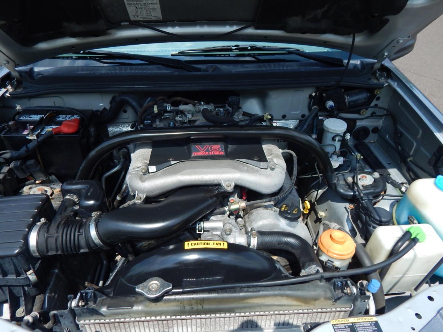 2004 Silver /Gray Cloth Chevrolet Tracker ZR2 4WD (2CNBJ734946) with an 2.5L V6 DOHC 24V engine, 4-Speed Automatic Overdrive transmission, located at 6528 Lower York Road, New Hope, PA, 18938, (215) 862-9555, 40.358707, -74.977882 - Here we have a Chevrolet Tracker with a 2.5L V6 putting power to a 4x4 automatic transmission. Options include: gray cloth, keyless entry, 1 remote and 1 key, cruise control, tilt steering wheel, A/C, power windows, power locks, power mirrors, AM/FM/CD radio, drivers/passengers front airbag for safe - Photo#21