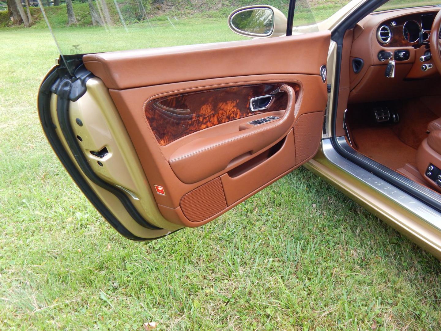 2005 Gold /Saddle Leather Bentley Continental GT Coupe (SCBCR63W25C) with an 6.0L W12 DOHC 48V TURBO engine, 6-Speed Automatic Overdrive transmission, located at 6528 Lower York Road, New Hope, PA, 18938, (215) 862-9555, 40.358707, -74.977882 - Here for sale is a very clean 3 owner 2005 Bentley Continental GT.....Gold paint with Saddle leather interior, All Wheel Drive is powered by a 6.0 Liter W 12 twin turbo engine, automatic or self shift transmission, dual, heated power front seats, tilt wheel, cruise control, dual climate control, bea - Photo#14