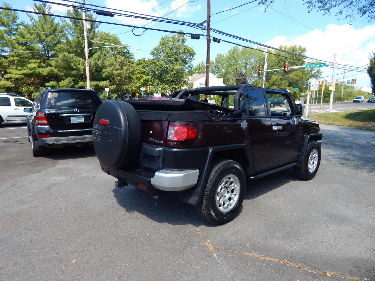 2007 Black Cherry Pearl /Black Cloth Toyota FJ Cruiser 4WD AT (JTEBU11FX70) with an 3.4L V6 DOHC 24V engine, 5-Speed Automatic Overdrive transmission, located at 6528 Lower York Road, New Hope, PA, 18938, (215) 862-9555, 40.358707, -74.977882 - 2007 Toyota F J Cruiser Convertible, only 38 of these were subtracted from Toyota, she is finished in Black Cherry Pearl paint, has black cloth seating. Powered by a 4.0 Liter V6 engine, automatic transmission and 4 wheel drive. Tilt wheel, cruise control, power windows, locks, 4 doors, Cold Air co - Photo#27