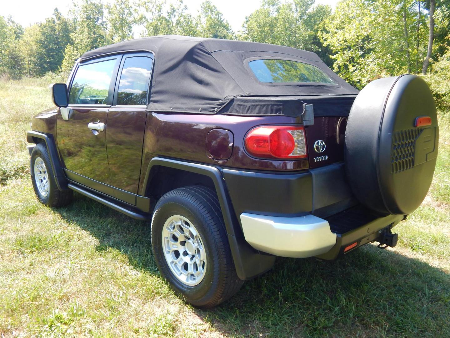 2007 Black Cherry Pearl /Black Cloth Toyota FJ Cruiser 4WD AT (JTEBU11FX70) with an 3.4L V6 DOHC 24V engine, 5-Speed Automatic Overdrive transmission, located at 6528 Lower York Road, New Hope, PA, 18938, (215) 862-9555, 40.358707, -74.977882 - 2007 Toyota F J Cruiser Convertible, only 38 of these were subtracted from Toyota, she is finished in Black Cherry Pearl paint, has black cloth seating. Powered by a 4.0 Liter V6 engine, automatic transmission and 4 wheel drive. Tilt wheel, cruise control, power windows, locks, 4 doors, Cold Air co - Photo#2