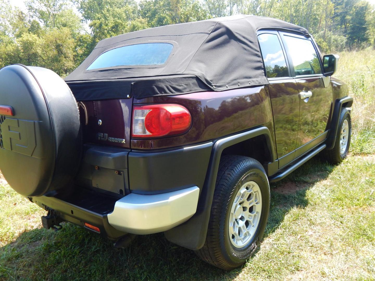 2007 Black Cherry Pearl /Black Cloth Toyota FJ Cruiser 4WD AT (JTEBU11FX70) with an 3.4L V6 DOHC 24V engine, 5-Speed Automatic Overdrive transmission, located at 6528 Lower York Road, New Hope, PA, 18938, (215) 862-9555, 40.358707, -74.977882 - 2007 Toyota F J Cruiser Convertible, only 38 of these were subtracted from Toyota, she is finished in Black Cherry Pearl paint, has black cloth seating. Powered by a 4.0 Liter V6 engine, automatic transmission and 4 wheel drive. Tilt wheel, cruise control, power windows, locks, 4 doors, Cold Air co - Photo#5