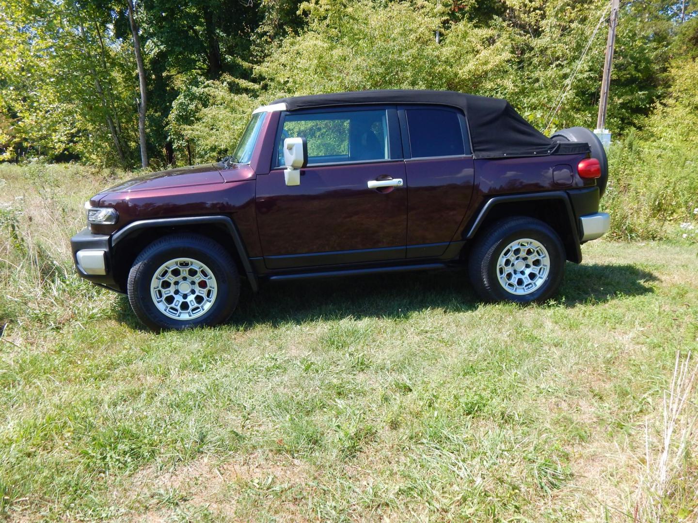 2007 Black Cherry Pearl /Black Cloth Toyota FJ Cruiser 4WD AT (JTEBU11FX70) with an 3.4L V6 DOHC 24V engine, 5-Speed Automatic Overdrive transmission, located at 6528 Lower York Road, New Hope, PA, 18938, (215) 862-9555, 40.358707, -74.977882 - 2007 Toyota F J Cruiser Convertible, only 38 of these were subtracted from Toyota, she is finished in Black Cherry Pearl paint, has black cloth seating. Powered by a 4.0 Liter V6 engine, automatic transmission and 4 wheel drive. Tilt wheel, cruise control, power windows, locks, 4 doors, Cold Air co - Photo#1