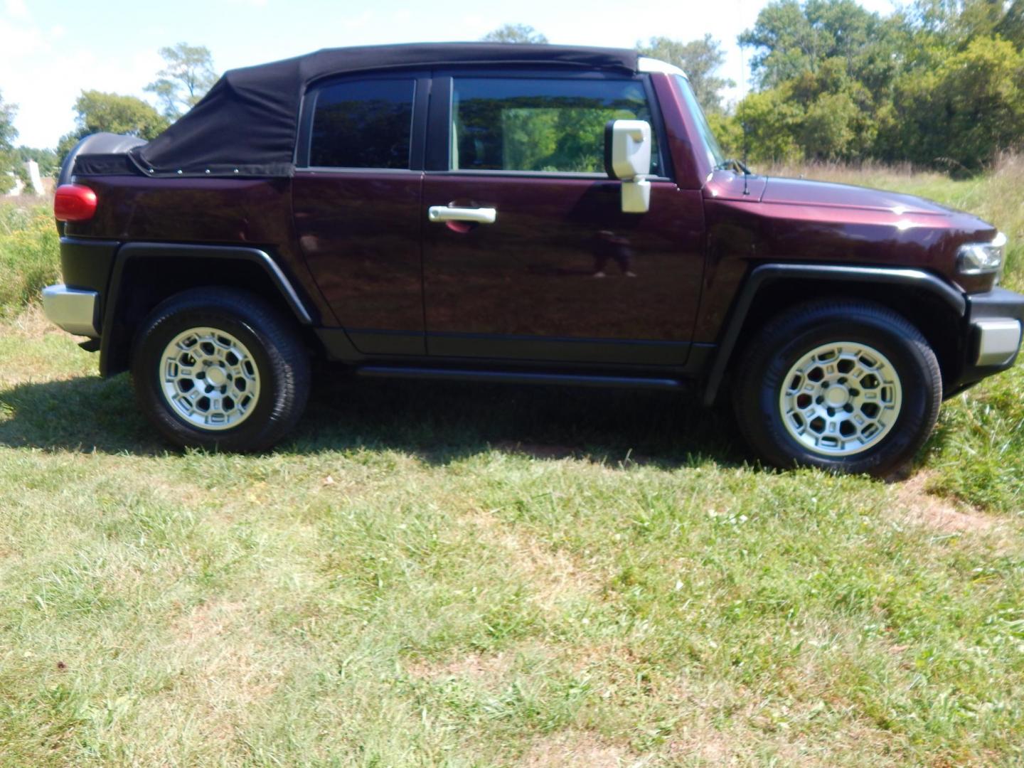 2007 Black Cherry Pearl /Black Cloth Toyota FJ Cruiser 4WD AT (JTEBU11FX70) with an 3.4L V6 DOHC 24V engine, 5-Speed Automatic Overdrive transmission, located at 6528 Lower York Road, New Hope, PA, 18938, (215) 862-9555, 40.358707, -74.977882 - 2007 Toyota F J Cruiser Convertible, only 38 of these were subtracted from Toyota, she is finished in Black Cherry Pearl paint, has black cloth seating. Powered by a 4.0 Liter V6 engine, automatic transmission and 4 wheel drive. Tilt wheel, cruise control, power windows, locks, 4 doors, Cold Air co - Photo#4