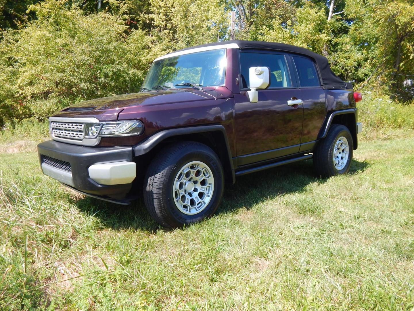 2007 Black Cherry Pearl /Black Cloth Toyota FJ Cruiser 4WD AT (JTEBU11FX70) with an 3.4L V6 DOHC 24V engine, 5-Speed Automatic Overdrive transmission, located at 6528 Lower York Road, New Hope, PA, 18938, (215) 862-9555, 40.358707, -74.977882 - 2007 Toyota F J Cruiser Convertible, only 38 of these were subtracted from Toyota, she is finished in Black Cherry Pearl paint, has black cloth seating. Powered by a 4.0 Liter V6 engine, automatic transmission and 4 wheel drive. Tilt wheel, cruise control, power windows, locks, 4 doors, Cold Air co - Photo#0