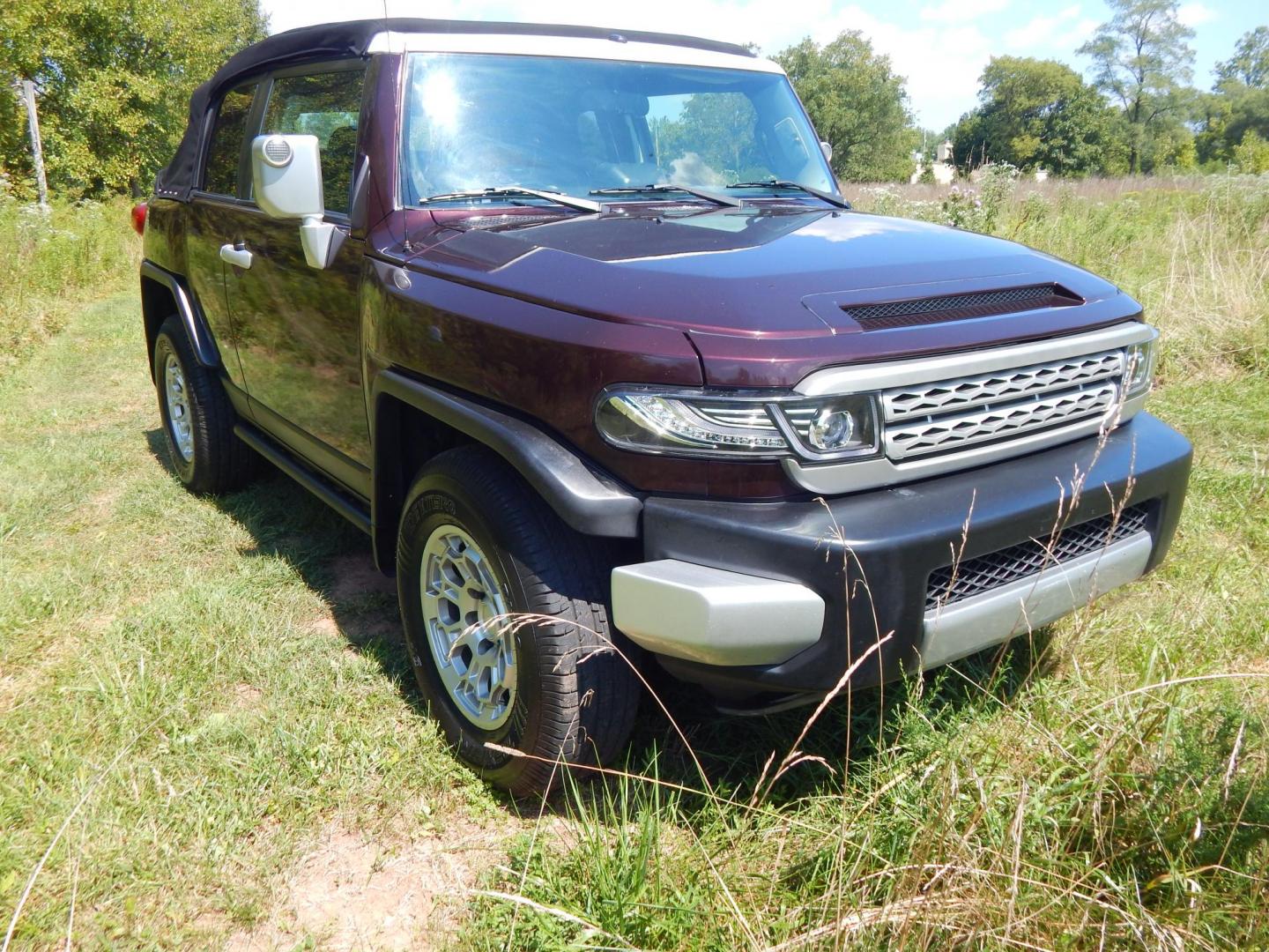 2007 Black Cherry Pearl /Black Cloth Toyota FJ Cruiser 4WD AT (JTEBU11FX70) with an 3.4L V6 DOHC 24V engine, 5-Speed Automatic Overdrive transmission, located at 6528 Lower York Road, New Hope, PA, 18938, (215) 862-9555, 40.358707, -74.977882 - 2007 Toyota F J Cruiser Convertible, only 38 of these were subtracted from Toyota, she is finished in Black Cherry Pearl paint, has black cloth seating. Powered by a 4.0 Liter V6 engine, automatic transmission and 4 wheel drive. Tilt wheel, cruise control, power windows, locks, 4 doors, Cold Air co - Photo#3