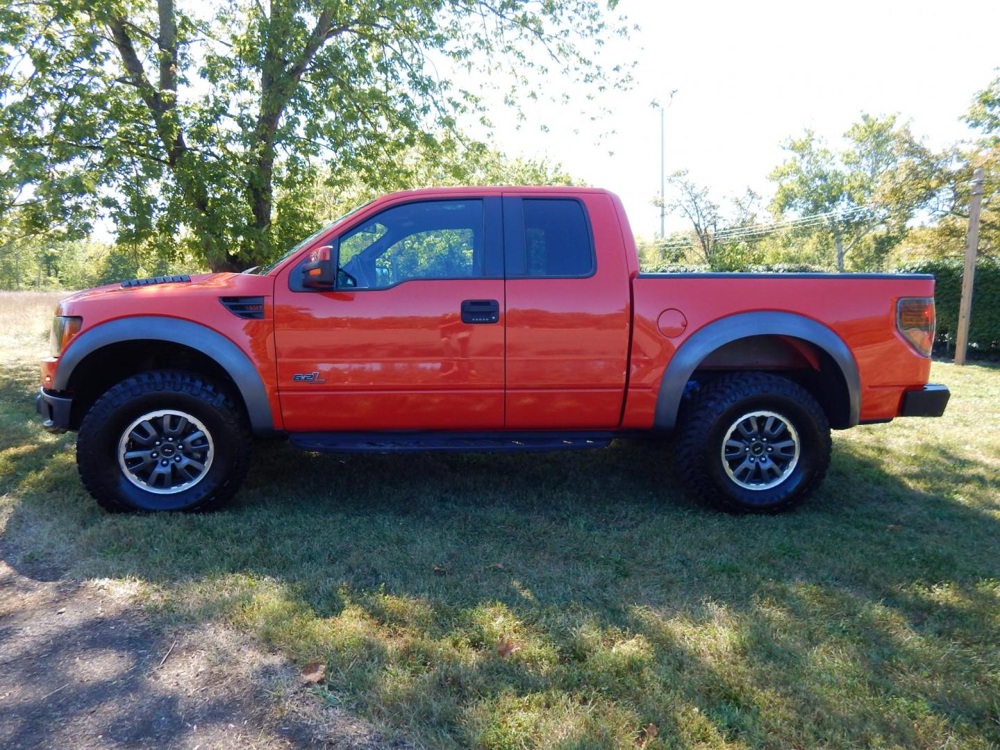 2011 Orange /Black/Red Leather Ford F-150 SVT Raptor SuperCab 5.5-ft. Bed 4WD (1FTEX1R64BF) with an 6.2L V8 SOHC 16V engine, 4-Speed Automatic transmission, located at 6528 Lower York Road, New Hope, PA, 18938, (215) 862-9555, 40.358707, -74.977882 - Here we have a very cool 2011 Ford F-150 SVT Raptor extended cab with a 6.2L V8 putting power to all 4 wheels via an automatic transmission with rear locking differential. Options include: black/red leather, dual power seats, dual climate controls, heated front seats, power sunroof, aftermarket radi - Photo#1