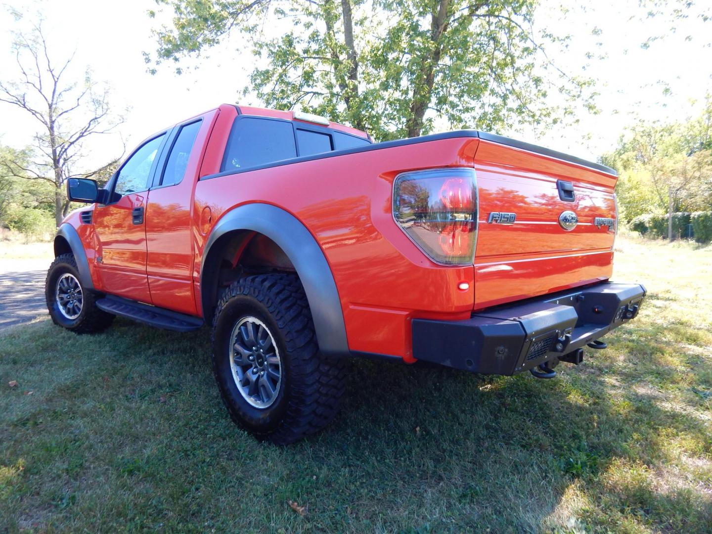 2011 Orange /Black/Red Leather Ford F-150 SVT Raptor SuperCab 5.5-ft. Bed 4WD (1FTEX1R64BF) with an 6.2L V8 SOHC 16V engine, 4-Speed Automatic transmission, located at 6528 Lower York Road, New Hope, PA, 18938, (215) 862-9555, 40.358707, -74.977882 - Here we have a very cool 2011 Ford F-150 SVT Raptor extended cab with a 6.2L V8 putting power to all 4 wheels via an automatic transmission with rear locking differential. Options include: black/red leather, dual power seats, dual climate controls, heated front seats, power sunroof, aftermarket radi - Photo#2