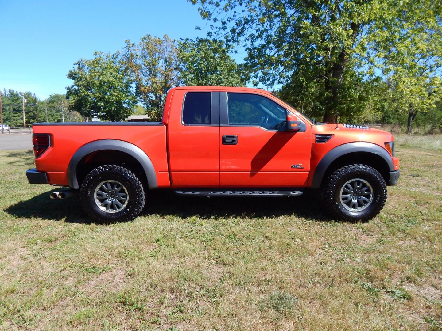 2011 Orange /Black/Red Leather Ford F-150 SVT Raptor SuperCab 5.5-ft. Bed 4WD (1FTEX1R64BF) with an 6.2L V8 SOHC 16V engine, 4-Speed Automatic transmission, located at 6528 Lower York Road, New Hope, PA, 18938, (215) 862-9555, 40.358707, -74.977882 - Here we have a very cool 2011 Ford F-150 SVT Raptor extended cab with a 6.2L V8 putting power to all 4 wheels via an automatic transmission with rear locking differential. Options include: black/red leather, dual power seats, dual climate controls, heated front seats, power sunroof, aftermarket radi - Photo#21