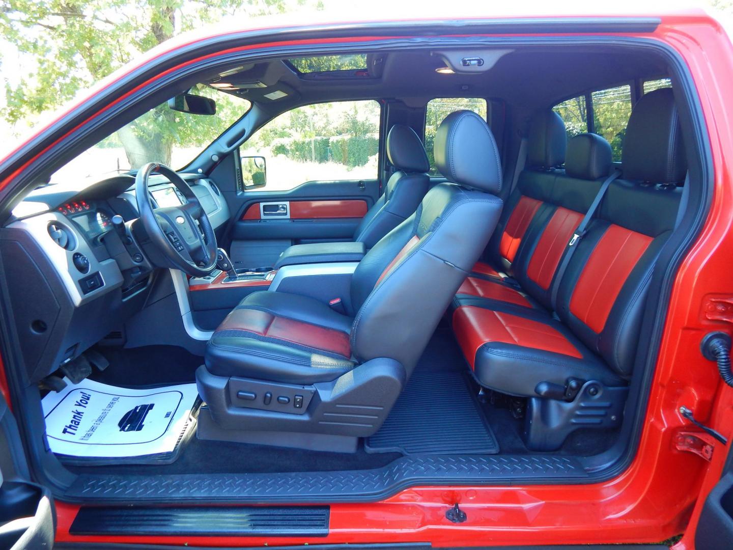 2011 Orange /Black/Red Leather Ford F-150 SVT Raptor SuperCab 5.5-ft. Bed 4WD (1FTEX1R64BF) with an 6.2L V8 SOHC 16V engine, 4-Speed Automatic transmission, located at 6528 Lower York Road, New Hope, PA, 18938, (215) 862-9555, 40.358707, -74.977882 - Here we have a very cool 2011 Ford F-150 SVT Raptor extended cab with a 6.2L V8 putting power to all 4 wheels via an automatic transmission with rear locking differential. Options include: black/red leather, dual power seats, dual climate controls, heated front seats, power sunroof, aftermarket radi - Photo#26