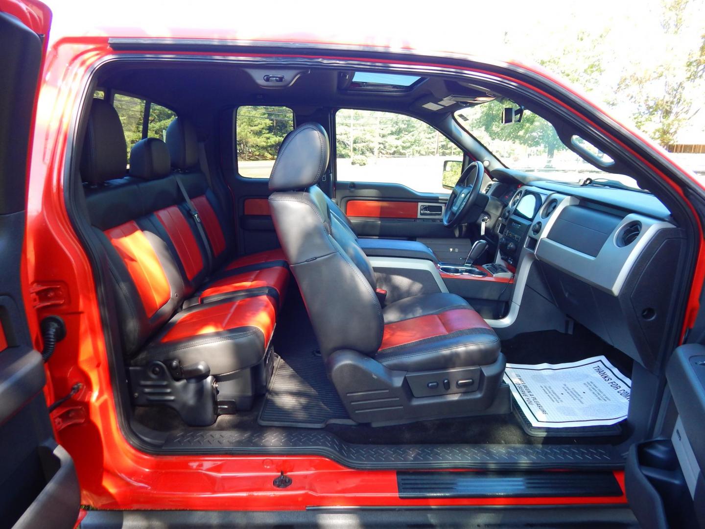 2011 Orange /Black/Red Leather Ford F-150 SVT Raptor SuperCab 5.5-ft. Bed 4WD (1FTEX1R64BF) with an 6.2L V8 SOHC 16V engine, 4-Speed Automatic transmission, located at 6528 Lower York Road, New Hope, PA, 18938, (215) 862-9555, 40.358707, -74.977882 - Here we have a very cool 2011 Ford F-150 SVT Raptor extended cab with a 6.2L V8 putting power to all 4 wheels via an automatic transmission with rear locking differential. Options include: black/red leather, dual power seats, dual climate controls, heated front seats, power sunroof, aftermarket radi - Photo#33