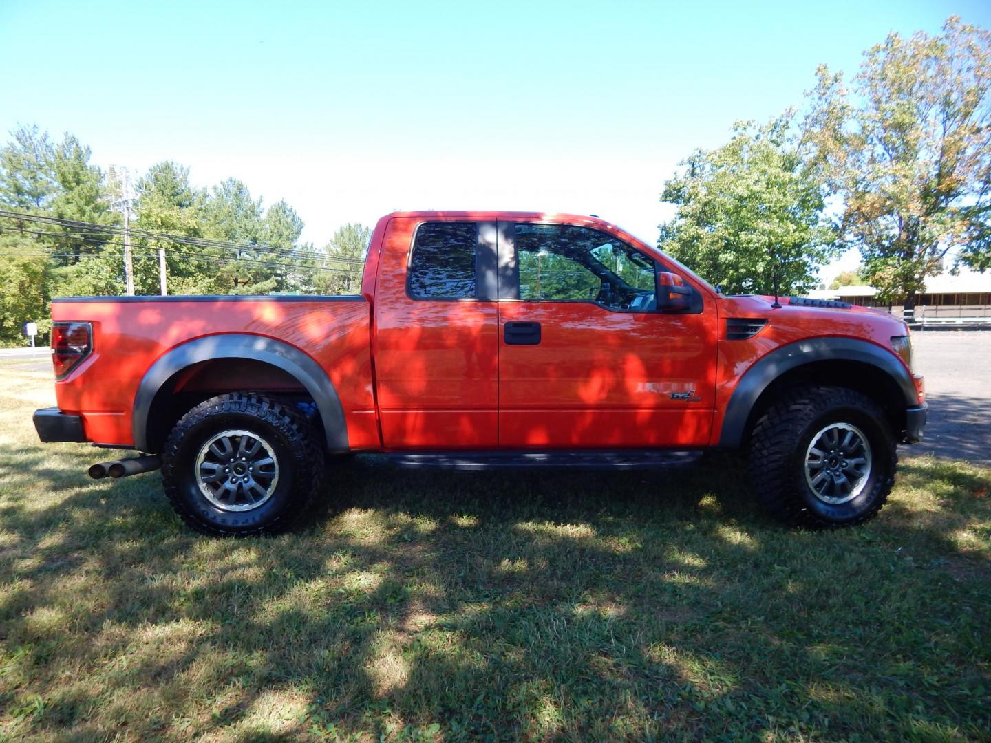 2011 Orange /Black/Red Leather Ford F-150 SVT Raptor SuperCab 5.5-ft. Bed 4WD (1FTEX1R64BF) with an 6.2L V8 SOHC 16V engine, 4-Speed Automatic transmission, located at 6528 Lower York Road, New Hope, PA, 18938, (215) 862-9555, 40.358707, -74.977882 - Here we have a very cool 2011 Ford F-150 SVT Raptor extended cab with a 6.2L V8 putting power to all 4 wheels via an automatic transmission with rear locking differential. Options include: black/red leather, dual power seats, dual climate controls, heated front seats, power sunroof, aftermarket radi - Photo#5