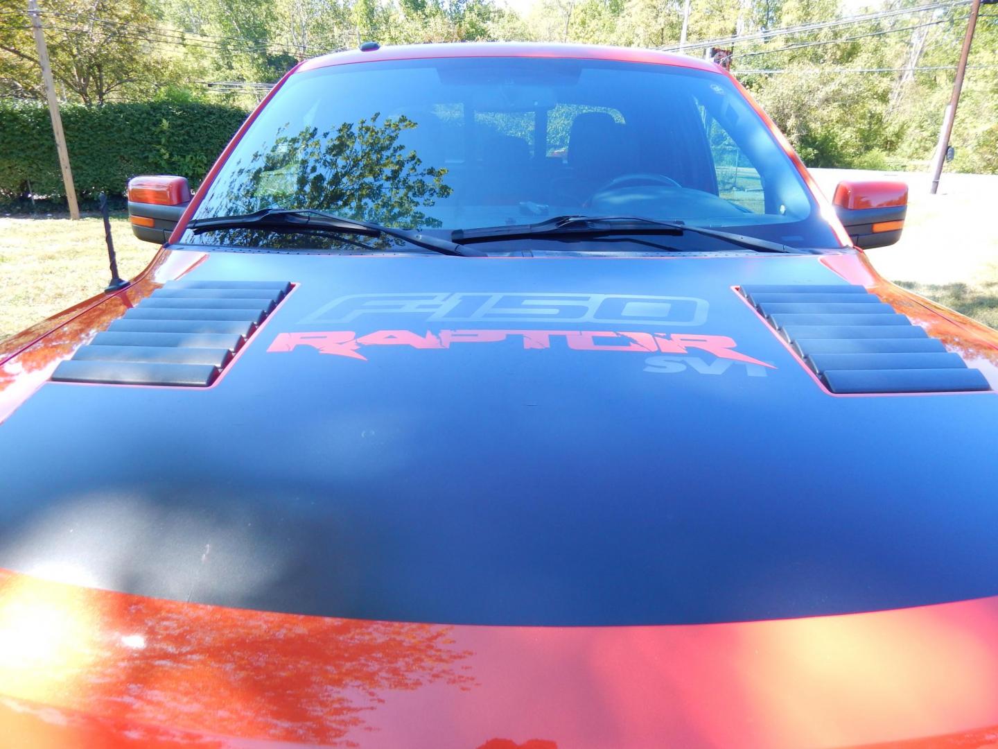 2011 Orange /Black/Red Leather Ford F-150 SVT Raptor SuperCab 5.5-ft. Bed 4WD (1FTEX1R64BF) with an 6.2L V8 SOHC 16V engine, 4-Speed Automatic transmission, located at 6528 Lower York Road, New Hope, PA, 18938, (215) 862-9555, 40.358707, -74.977882 - Here we have a very cool 2011 Ford F-150 SVT Raptor extended cab with a 6.2L V8 putting power to all 4 wheels via an automatic transmission with rear locking differential. Options include: black/red leather, dual power seats, dual climate controls, heated front seats, power sunroof, aftermarket radi - Photo#6